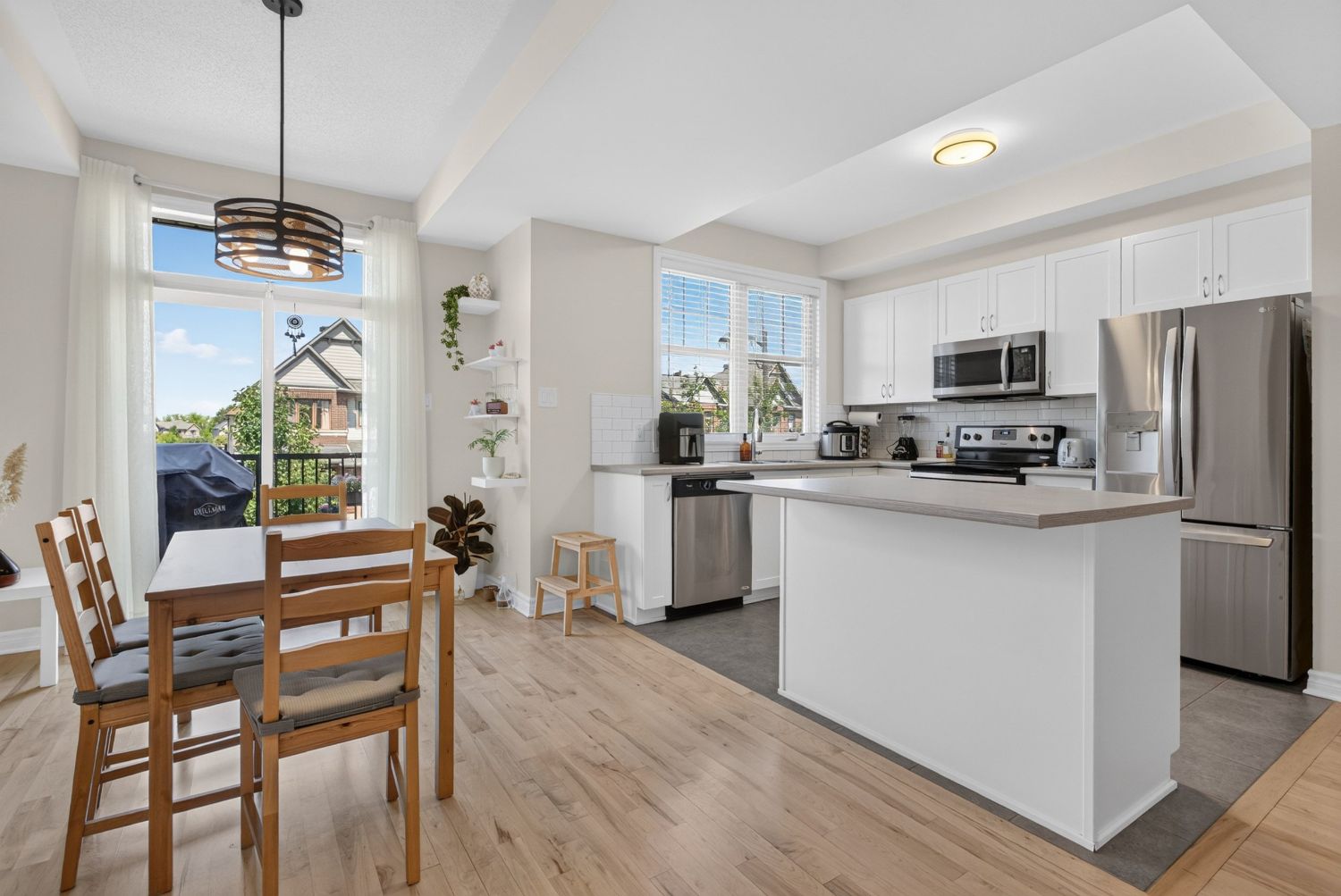 Kitchen and breakfast area with balcony door